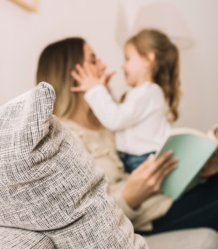 blurred-daughter-mother-reading-having-fun_23-2147896477