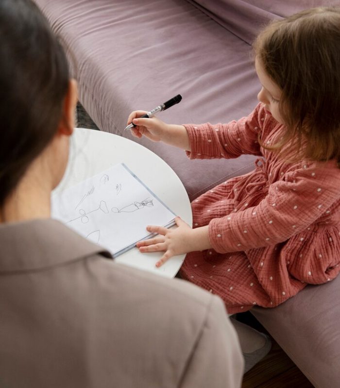 child-doing-therapy-session-with-psychologist_23-2149305204