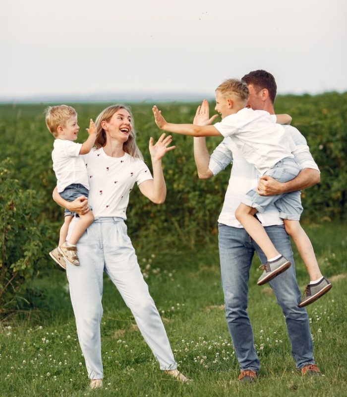 cute-family-playing-summer-field_1157-38899