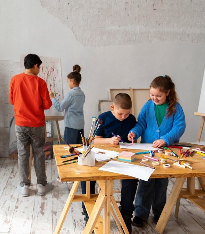 full-shot-kids-painting-school_23-2150385340