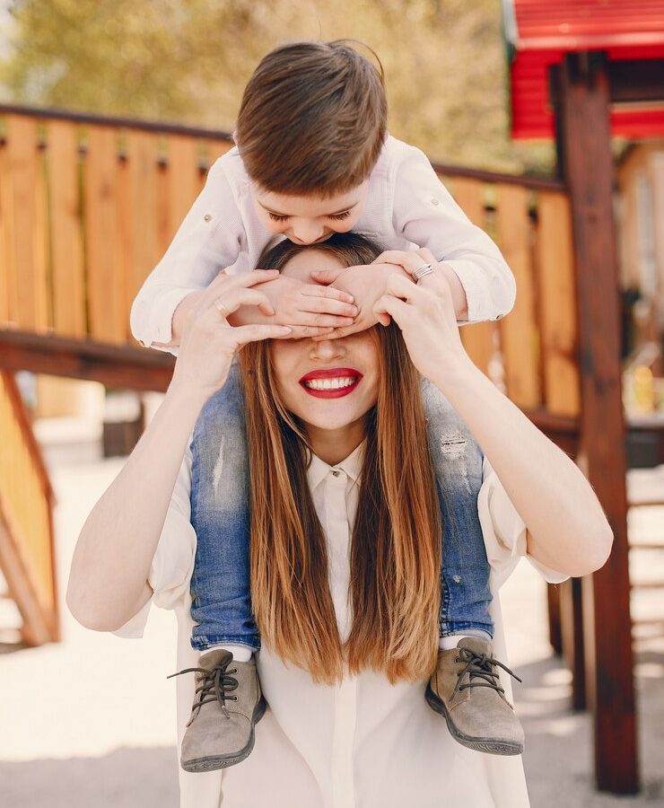 mother-with-son-playing-summer-park_1157-21834